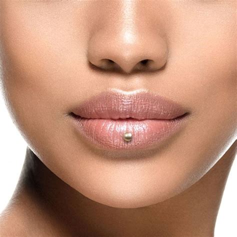 Lip piercing in middle - Traditional tongue piercing, when the stud is placed in the middle of the tongue. 4/10. 4 – 8 weeks. $30 to $50. Tongue Web. Perforation of the frenulum (the thin tissue connecting the tongue and the floor of …